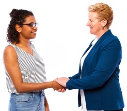 A woman holding another woman's hands.