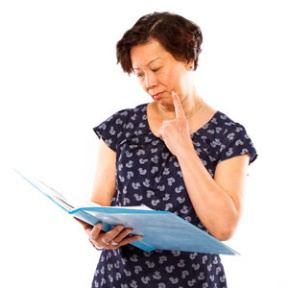 A woman reading a document. 