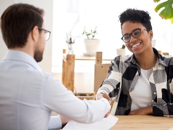 Two people shaking hands. 