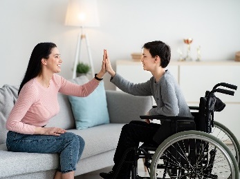 Two people having a high five.