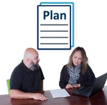 A man and woman looking at a plan. 