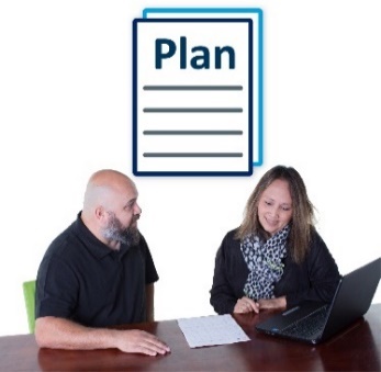 A man and woman looking at a plan. 