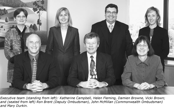 Executive team (standing from left): Katherine Campbell, Helen Fleming, Damien Browne, Vicki Brown; and (seated from left) Ron Brent (Deputy Ombudsman), John McMillan (Commonwealth Ombudsman) and Mary Durkin.