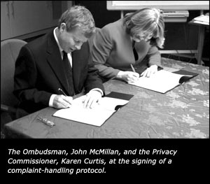 The Ombudsman, John McMillan, and the Privacy Commissioner, Karen Curtis, at the signing of a complaint-handling protocol.