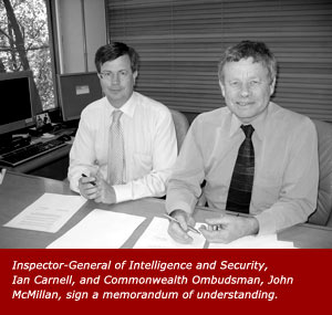 Inspector-General of Intelligence and Security, Ian Carnell, and Commonwealth Ombudsman, John McMillan, sign a memorandum of understanding.